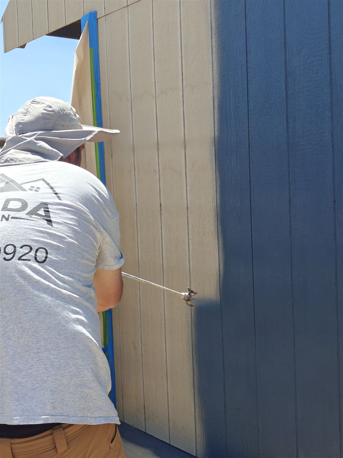 Exterior painting contractor working on a home near Broomfield, Colorado