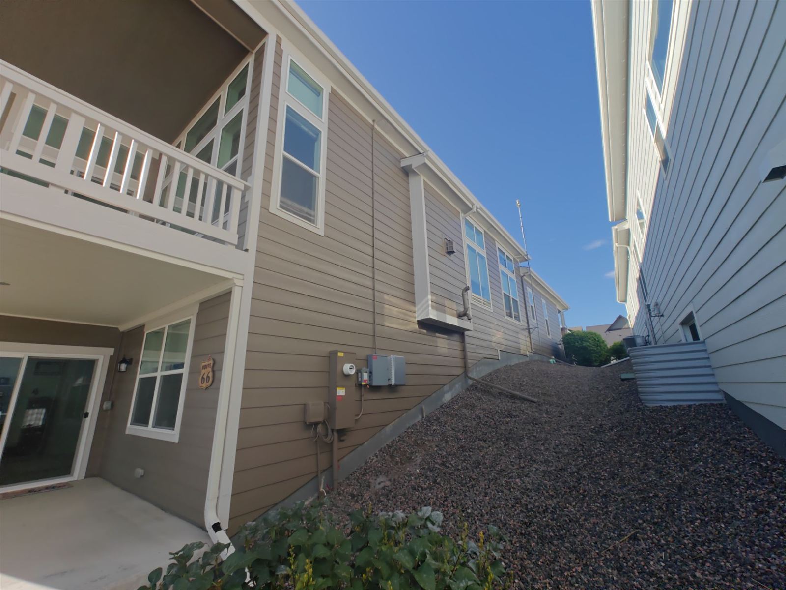 Finished rear patio and siding of the Arvada home after the color refresh