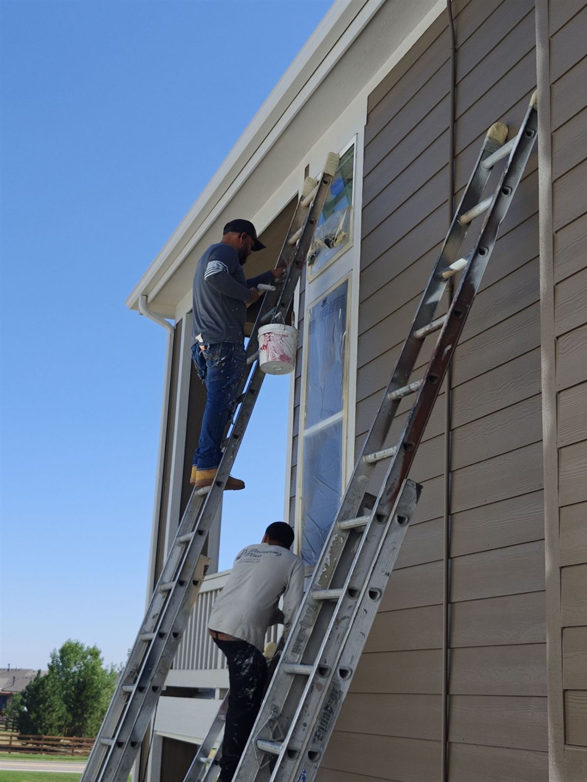 Two-story home exterior in Arvada, Colorado after a fresh repaint